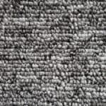 Dark grey and white textured rug with a loop pile design.