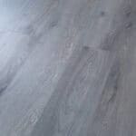 Grey wooden floor laminate for condo interiors and office spaces.