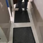 Rubber anti-slip mats for bathroom flooring installation and safety.