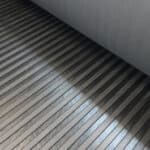 High-quality wooden floor tiles installed in a bedroom at Siam Flooring.