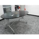Flexible office conference table with modern flooring for commercial use.