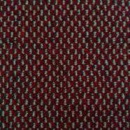 Colorful textured carpet with red, black, and beige dots, ideal for flooring in condos and bedrooms.