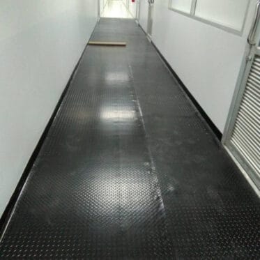 Installation of the rubber flooring on the walkway