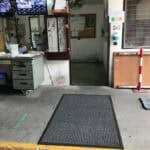 Durable office entrance mat with textured surface, ideal for commercial flooring solutions.