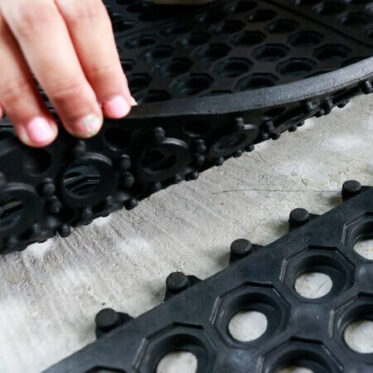 Interlocking mat with the holes