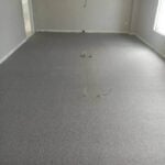Grey carpet flooring installed in a modern room, ready for commercial or residential space renovation.