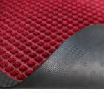 Non-slip red and black flooring material for residential or commercial use.