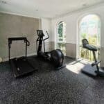 Gym flooring installation for condo and office spaces, durable slip-resistant surface.