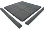 Durable black rubber flooring tiles with interlocking edges for versatile indoor and outdoor use.