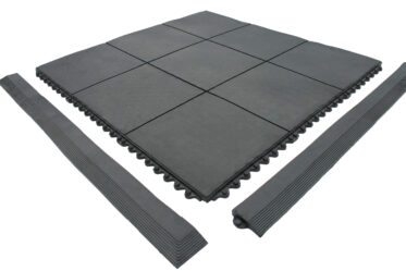 Durable black rubber flooring tiles with interlocking edges for versatile indoor and outdoor use.