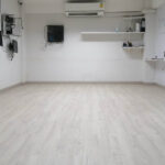 Polished light wood flooring in office or condo interior.