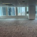 Luxury office carpet flooring installed in a high-rise building with city views.
