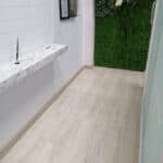 Wooden flooring installation in an office or condo hallway.