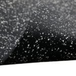 Black speckled rubber flooring with white flecks, ideal for condos and office spaces.