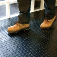 Rubber floor tiles installation for condos and offices, durable anti-slip flooring solution.