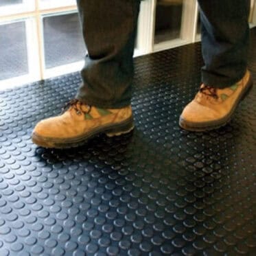 Rubber floor tiles installation for condos and offices, durable anti-slip flooring solution.
