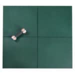 Green tile flooring laid in a room with a skateboard placed on the surface.