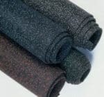 Rolls of speckled rubber flooring for residential and commercial use in condominiums and offices.