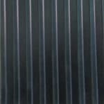 Black vinyl flooring with vertical stripes for residential and commercial spaces.