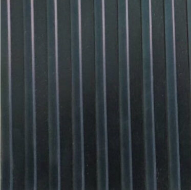 Black vinyl flooring with vertical stripes for residential and commercial spaces.