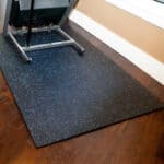 Rubber flooring mat with blue speckles for gym and exercise areas.