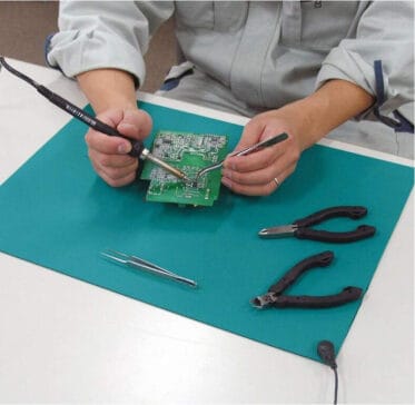 Precision electronic circuit repair work.