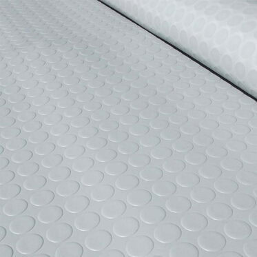 Non-slip white rubber floor tiles with circular pattern for commercial and residential spaces.
