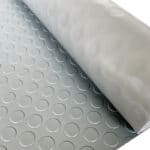 Flexible rubber flooring with circular patterns for residential and commercial use.
