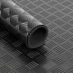 Flexible black anti-slip rubber flooring sheet with textured surface.