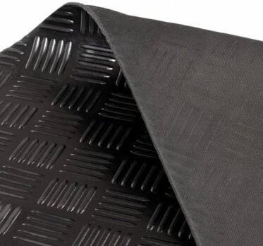 Heavy-duty black rubber flooring mat with a textured surface for industrial or commercial use.