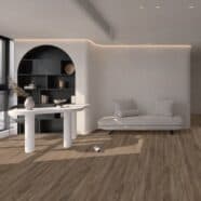 Modern living room with wooden flooring and minimalist furniture.