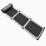 Black anti-slip floor tiles with a textured surface for durable indoor flooring solutions.