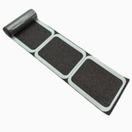 Black anti-slip floor tiles with a textured surface for durable indoor flooring solutions.