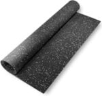Black speckled rubber yoga mat for workout or exercise, textured surface for grip.