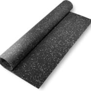 Black speckled rubber yoga mat for workout or exercise, textured surface for grip.