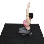 Non-slip black rubber flooring with white speckles for fitness and yoga mats.