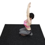 Non-slip black rubber flooring with white speckles for fitness and yoga mats.