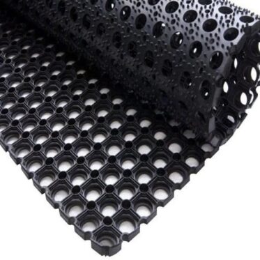 Flexible black drainage mat with hollow hexagon pattern for flooring projects.